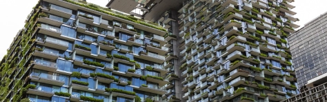 Apartment buildings with vertical gardens and heliostat with motorised mirrors, sky background with copy space, Green wall-BioWall or living wall is a wall covered with living plants on residential tower Sydney Australia - Real estate