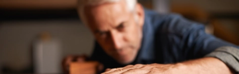 Cropped shot of a senior man working Art And Craft, Beautiful People, Business Finance and Industry, Businesswear, Candid, Carpenter, Carpentry, Casual Clothing, Construction Industry, Craft, Craftsperson, Design, Design Professional, Examining, Expertise, Finishing, Focus On Foreground, Grey Hair, Handsome People, Human Body Part, Human Hand,