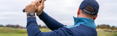 An image of a man holding a golf club