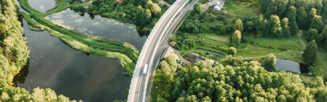 town near a road and lake